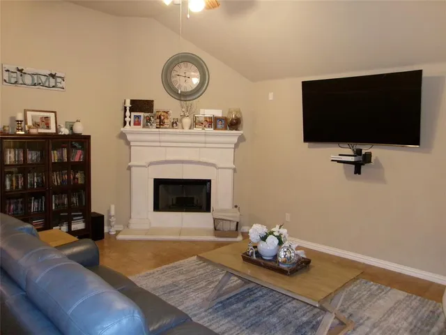 a bedroom with a bed and a night stand