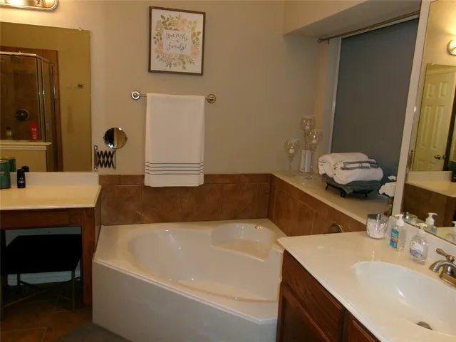 a bathroom with a shower and a sink
