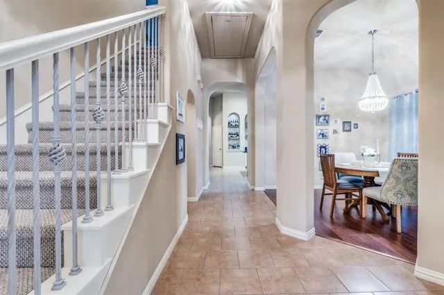 a view of a livingroom with furniture and staircase