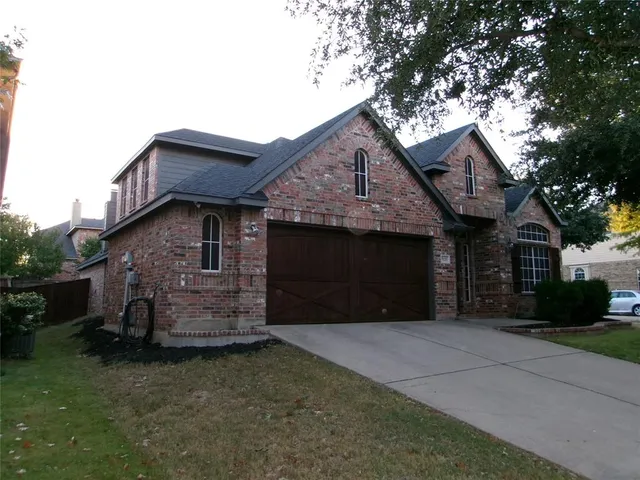 a kitchen with stainless steel appliances and cabinets