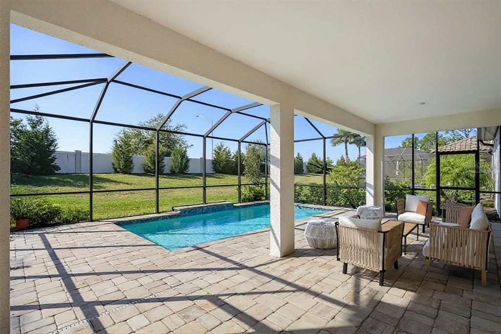19803 Bridgetown Loop Venice, FL 34293 - Photo 12 of 51 a view of a backyard with sitting area