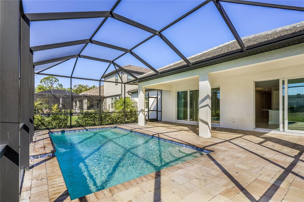 19803 Bridgetown Loop Venice, FL 34293 - Photo 14 of 51 a view of a house with backyard and sitting area