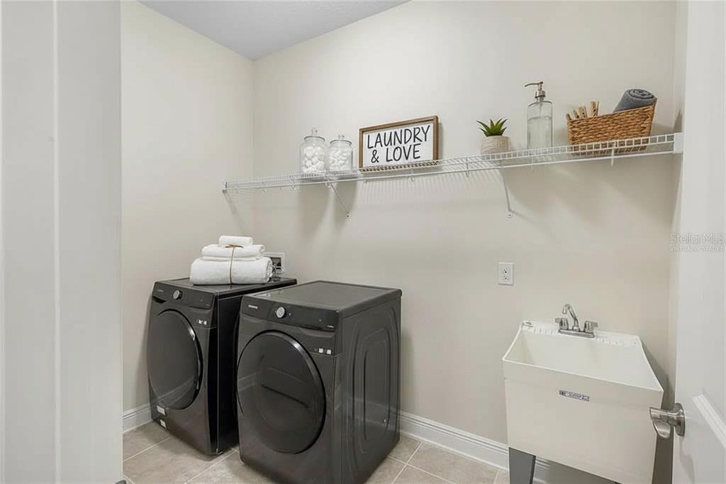 19803 Bridgetown Loop Venice, FL 34293 - Photo 17 of 51 a utility room with dryer and washer