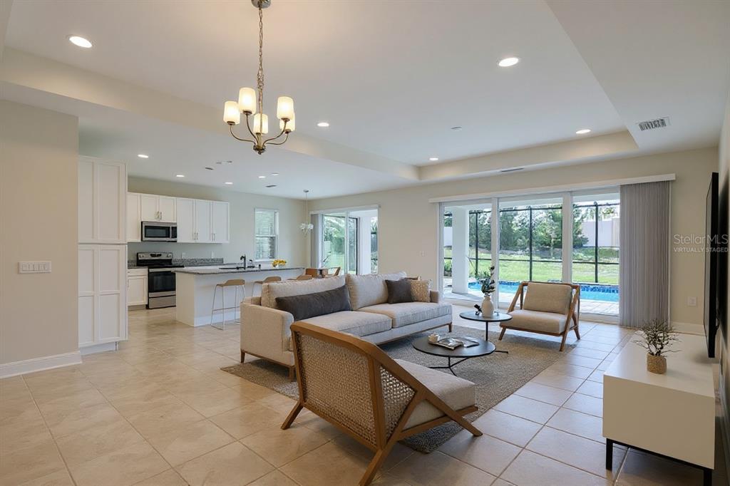 19803 Bridgetown Loop Venice, FL 34293 - Photo 3 of 51 a living room with furniture kitchen view and a large window