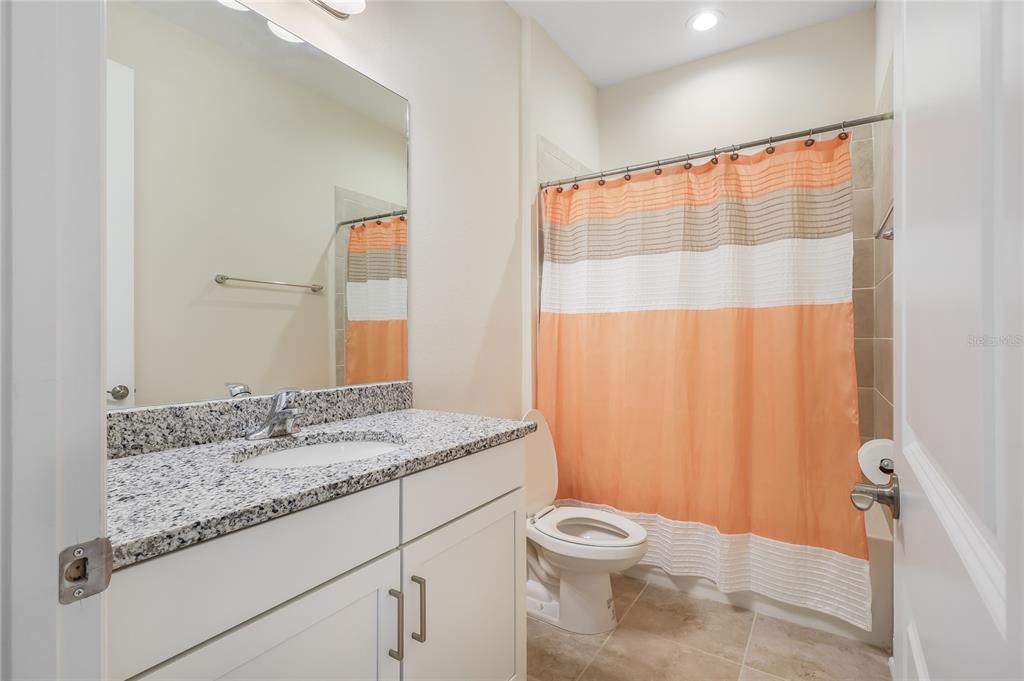 19803 Bridgetown Loop Venice, FL 34293 - Photo 37 of 51 a bathroom with a granite countertop sink and a mirror
