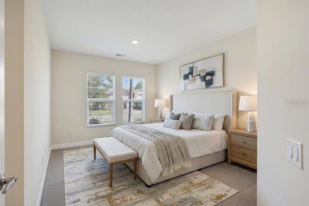 19803 Bridgetown Loop Venice, FL 34293 - Photo 4 of 51 a bedroom with a large bed and a window