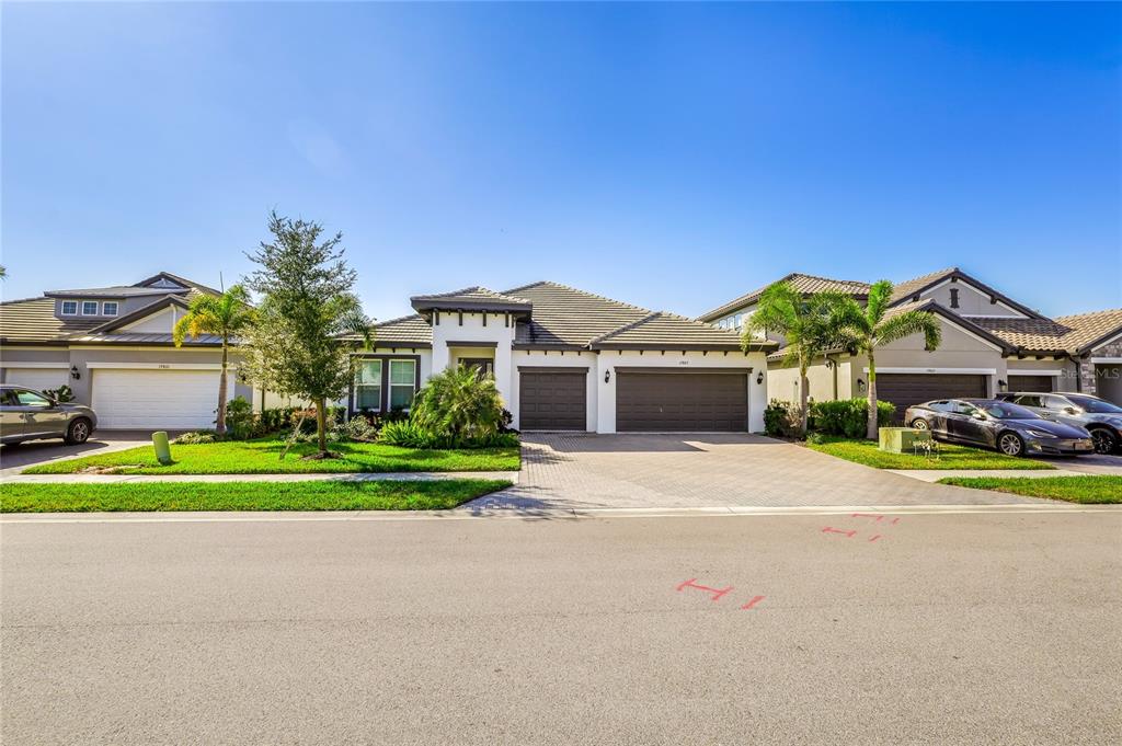 19803 Bridgetown Loop Venice, FL 34293 - Photo 48 of 51 a front view of house with yard and green space
