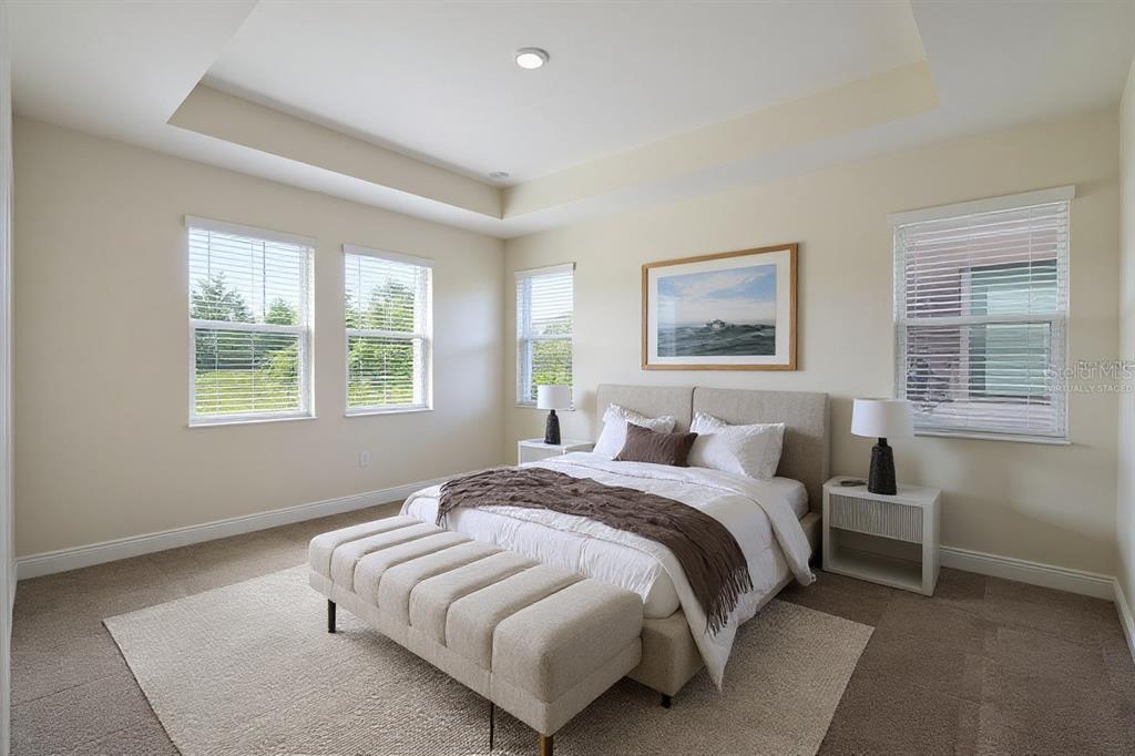 19803 Bridgetown Loop Venice, FL 34293 - Photo 6 of 51 a spacious bedroom with a bed and a window
