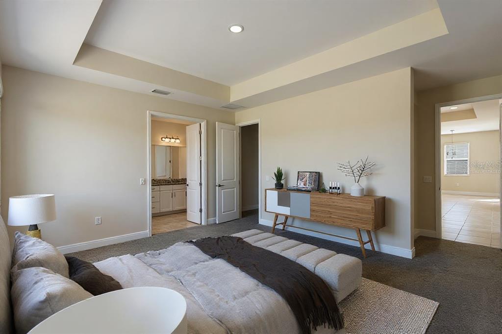 19803 Bridgetown Loop Venice, FL 34293 - Photo 7 of 51 a bedroom with a bed and wooden floor