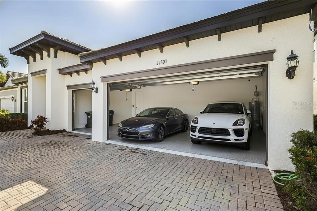19803 Bridgetown Loop Venice, FL 34293 - Photo 10 of 51 a car parked in front of a house