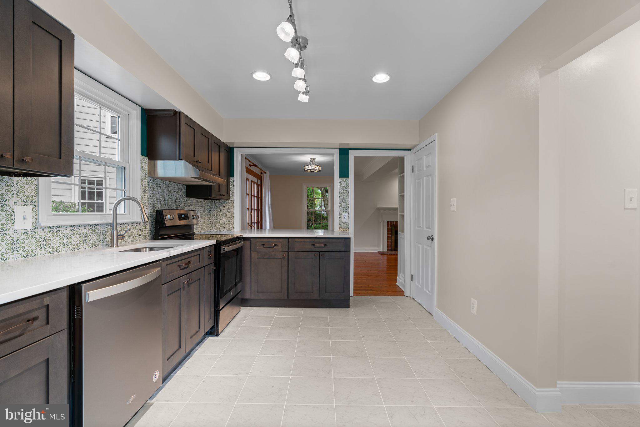 2 Oxley Square Road Gaithersburg, MD 20877 - Photo 13 of 49 a large kitchen with stainless steel appliances granite countertop a sink and cabinets