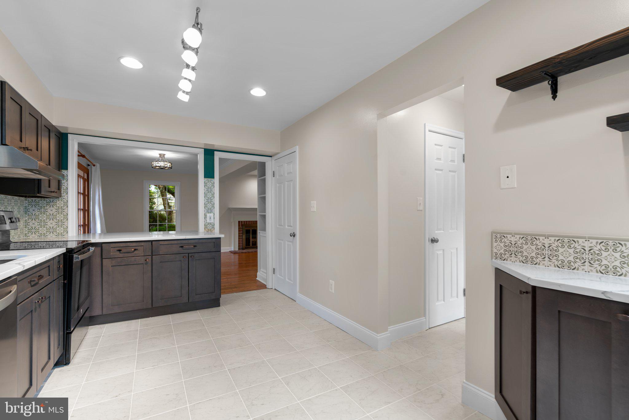 2 Oxley Square Road Gaithersburg, MD 20877 - Photo 14 of 49 a large kitchen with a sink and cabinets