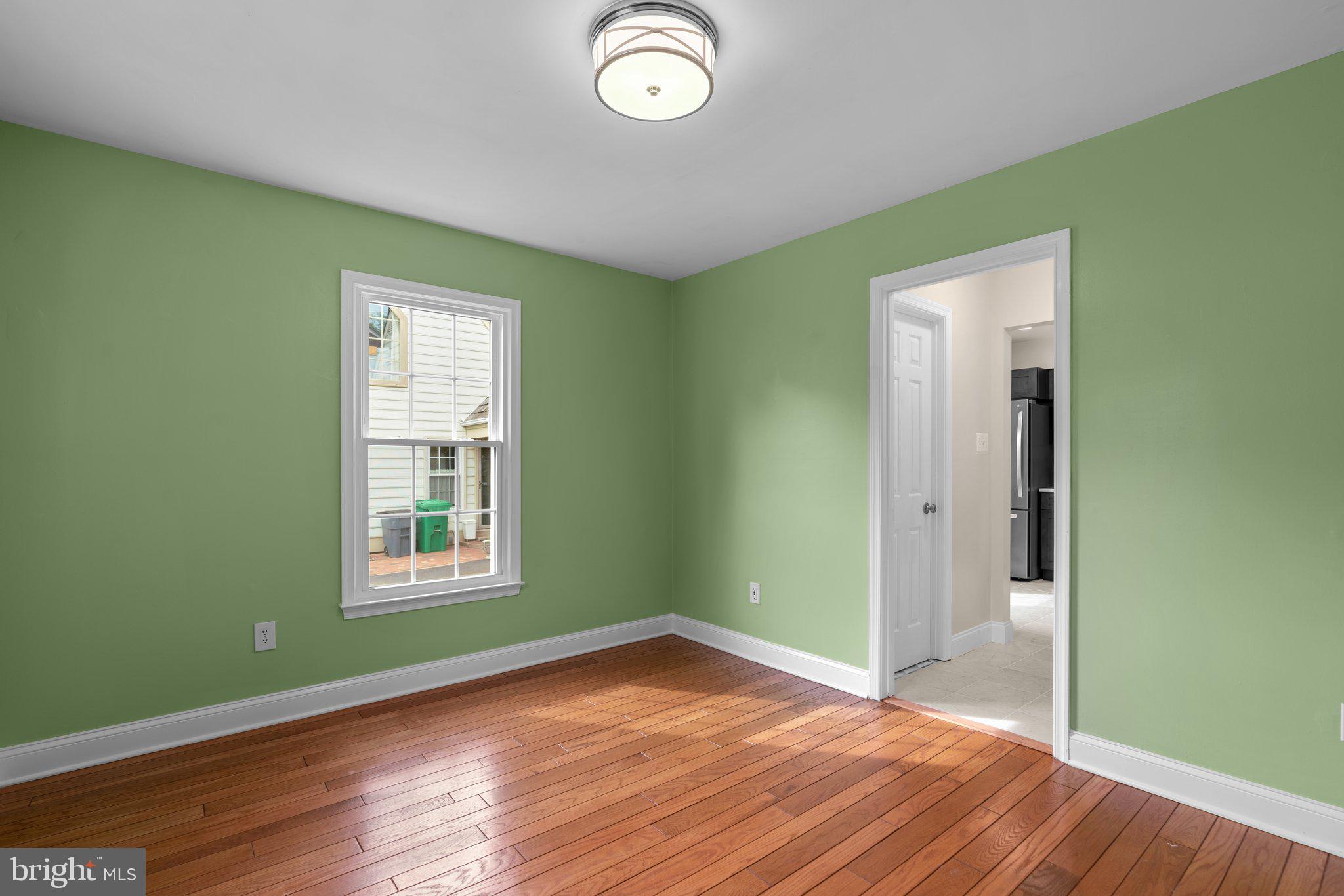2 Oxley Square Road Gaithersburg, MD 20877 - Photo 15 of 49 an empty room with wooden floor and windows