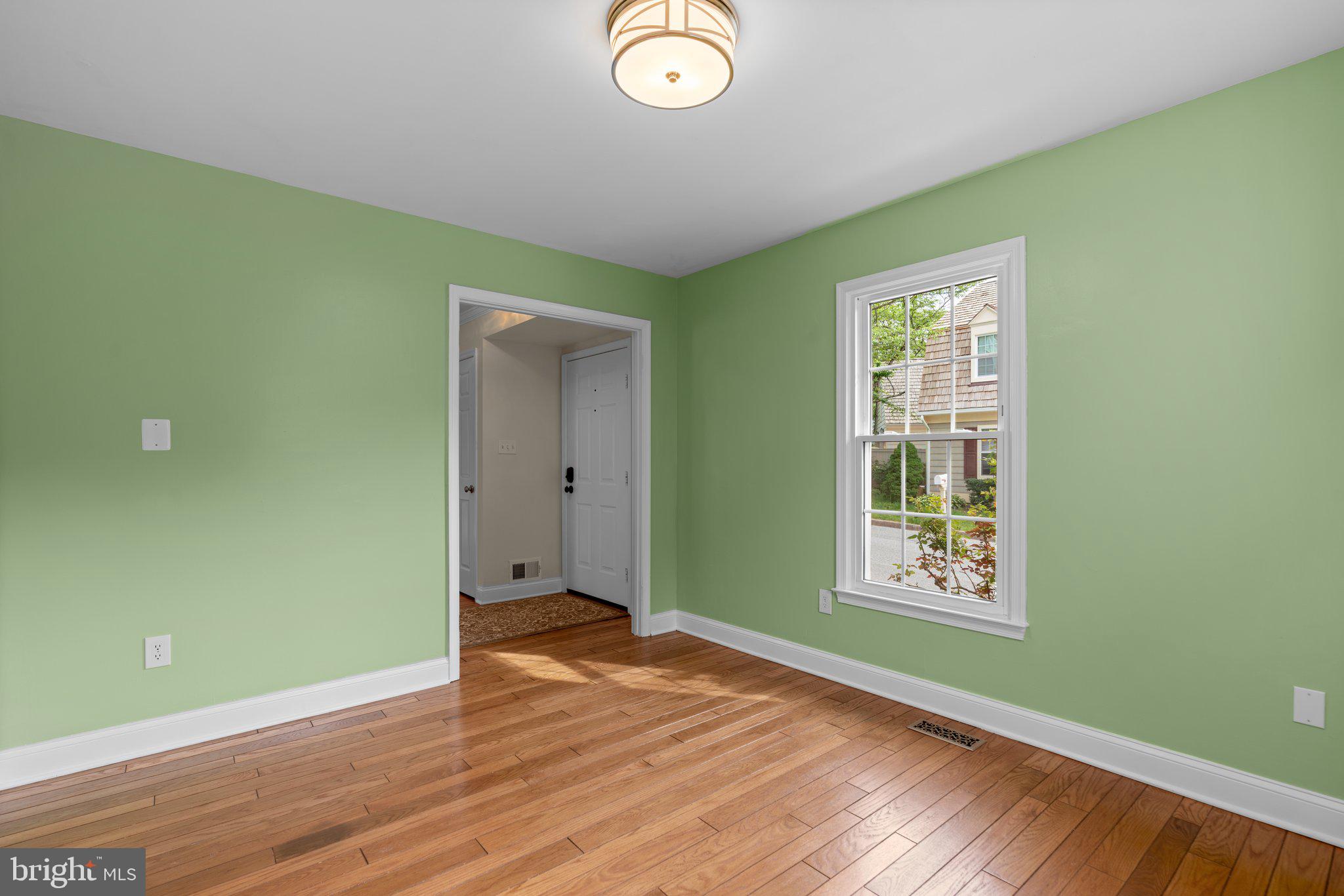 2 Oxley Square Road Gaithersburg, MD 20877 - Photo 16 of 49 an empty room with wooden floor and windows