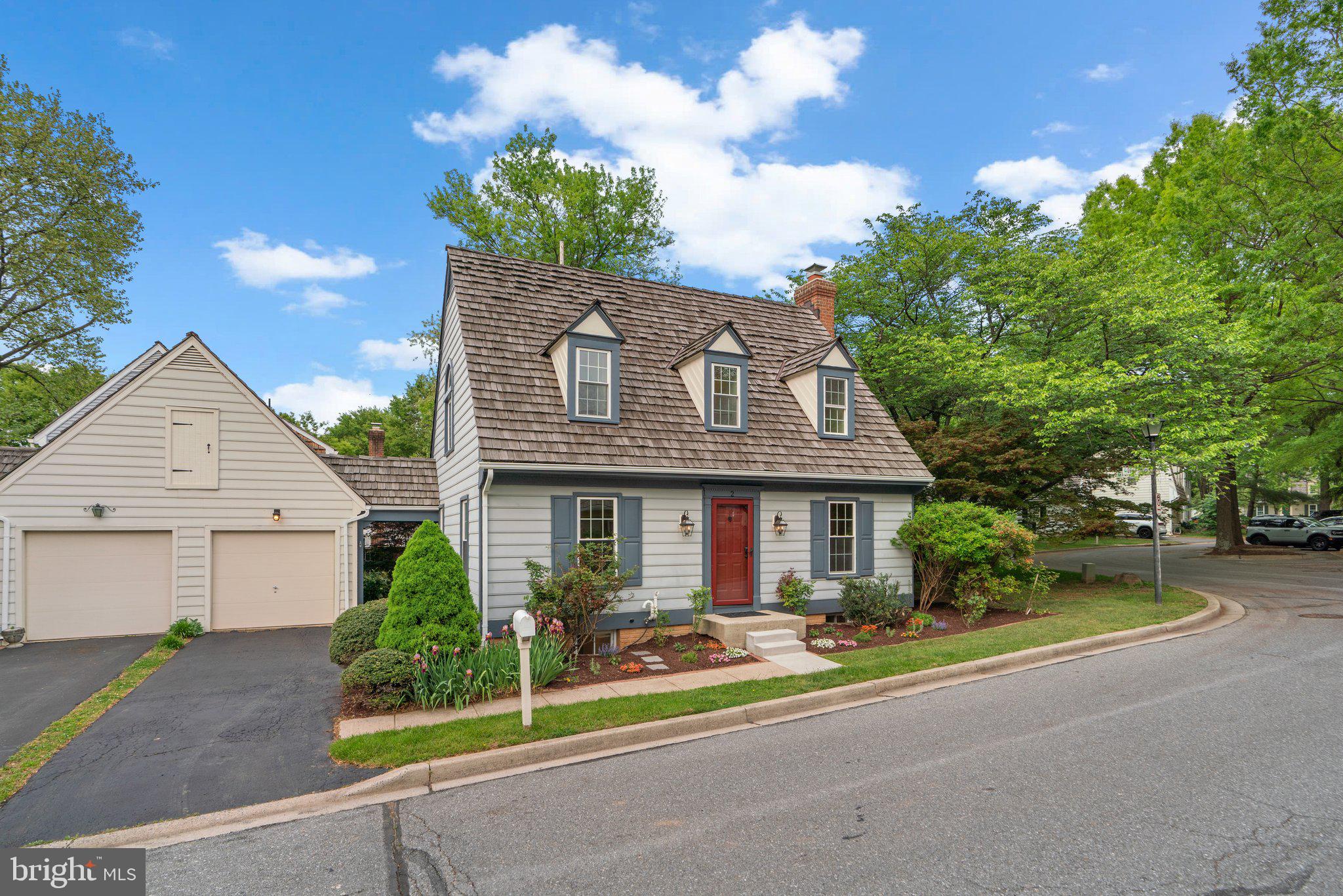 2 Oxley Square Road Gaithersburg, MD 20877 - Photo 2 of 49 a front view of a house with a yard and potted plants