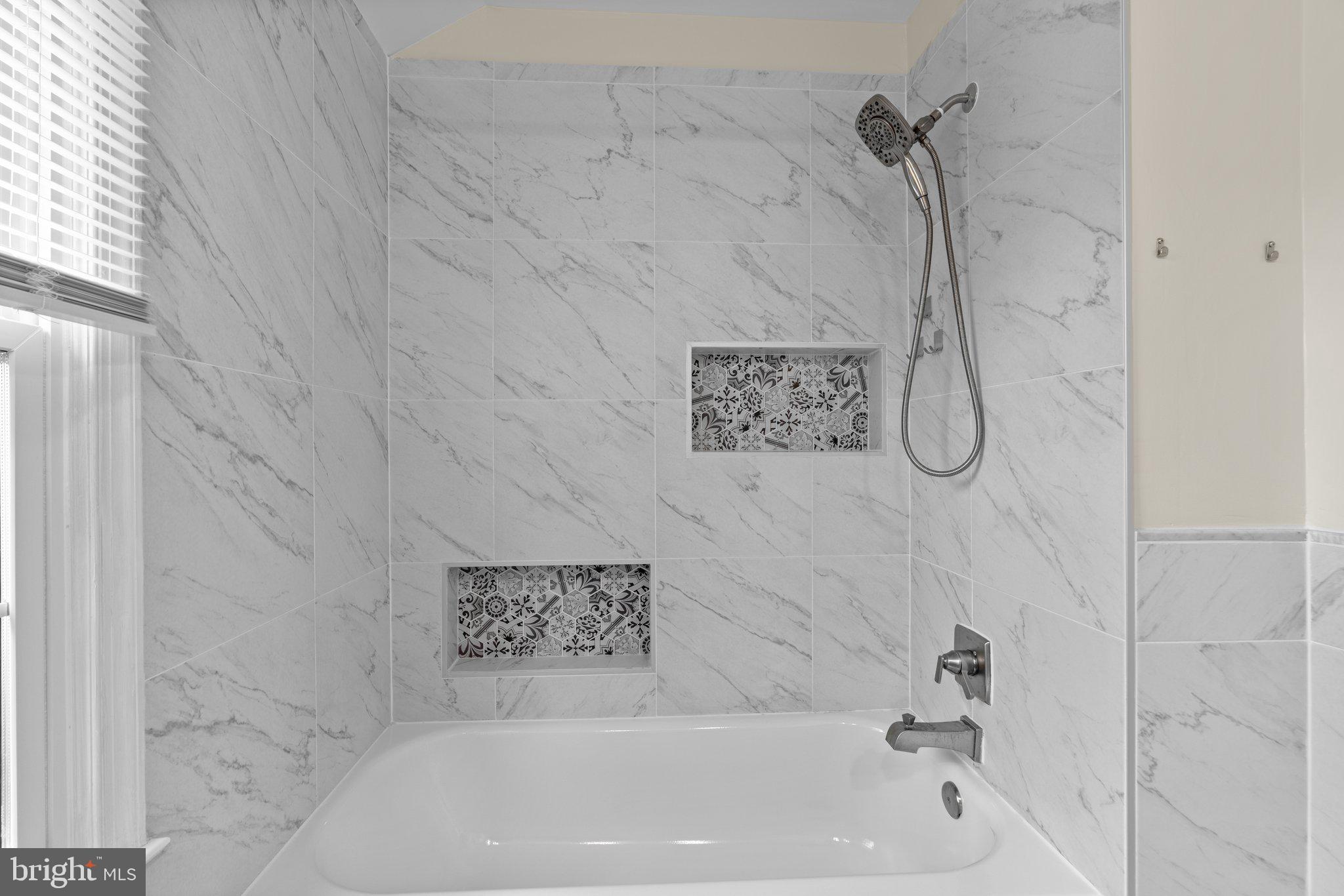 2 Oxley Square Road Gaithersburg, MD 20877 - Photo 24 of 49 a bathroom with a shower and a bathtub