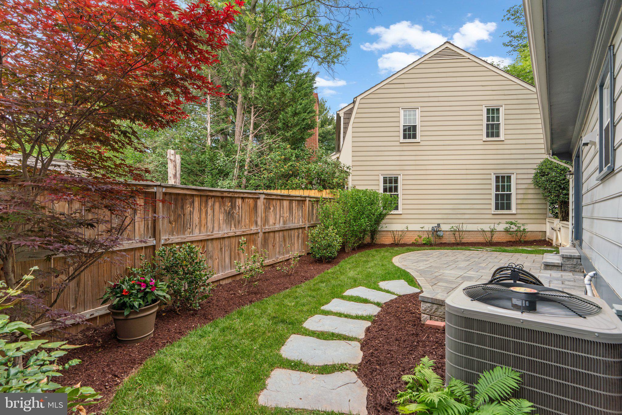2 Oxley Square Road Gaithersburg, MD 20877 - Photo 41 of 49 a view of a backyard with potted plants and large tree