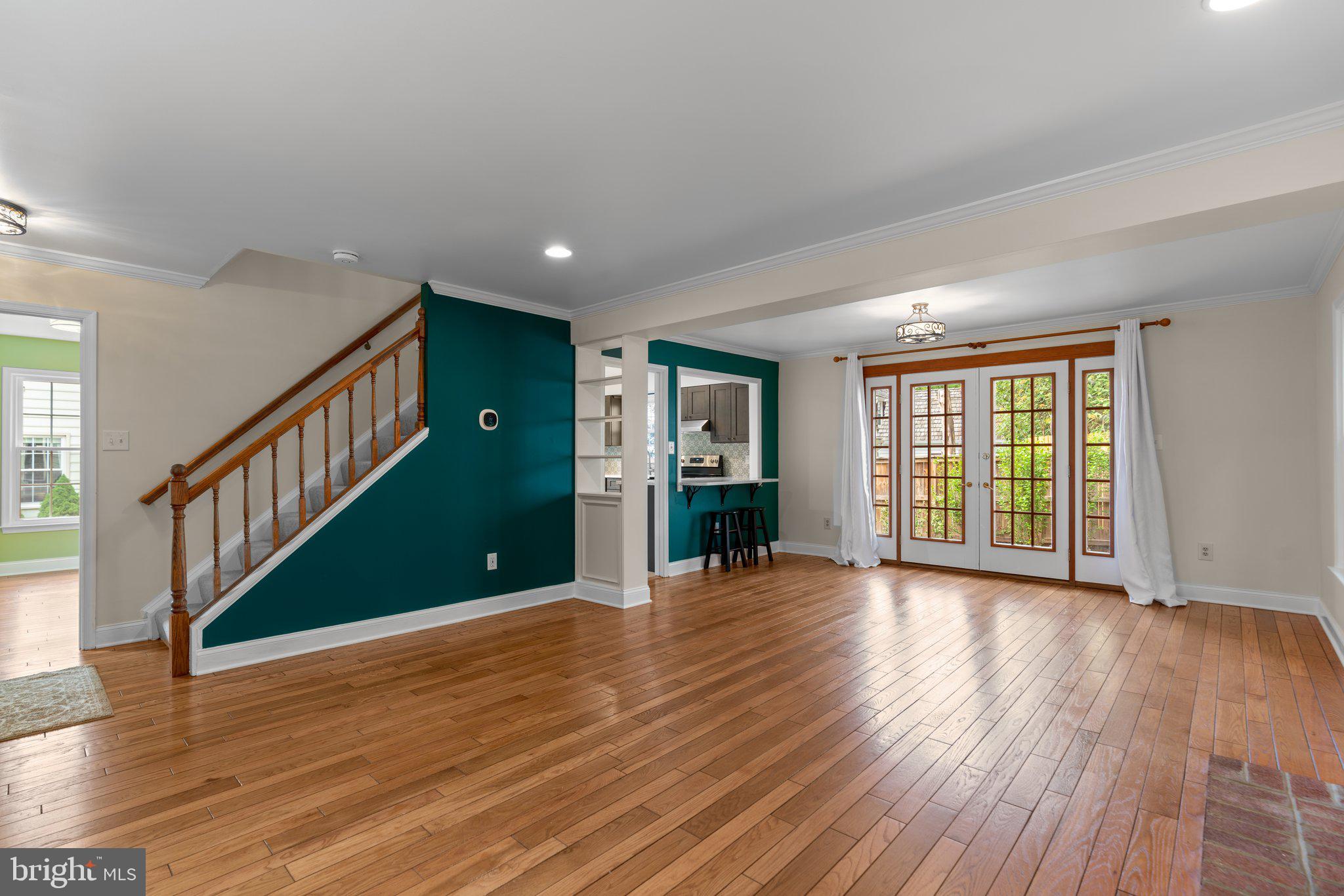 2 Oxley Square Road Gaithersburg, MD 20877 - Photo 6 of 49 a view of an empty room with wooden floor and a window