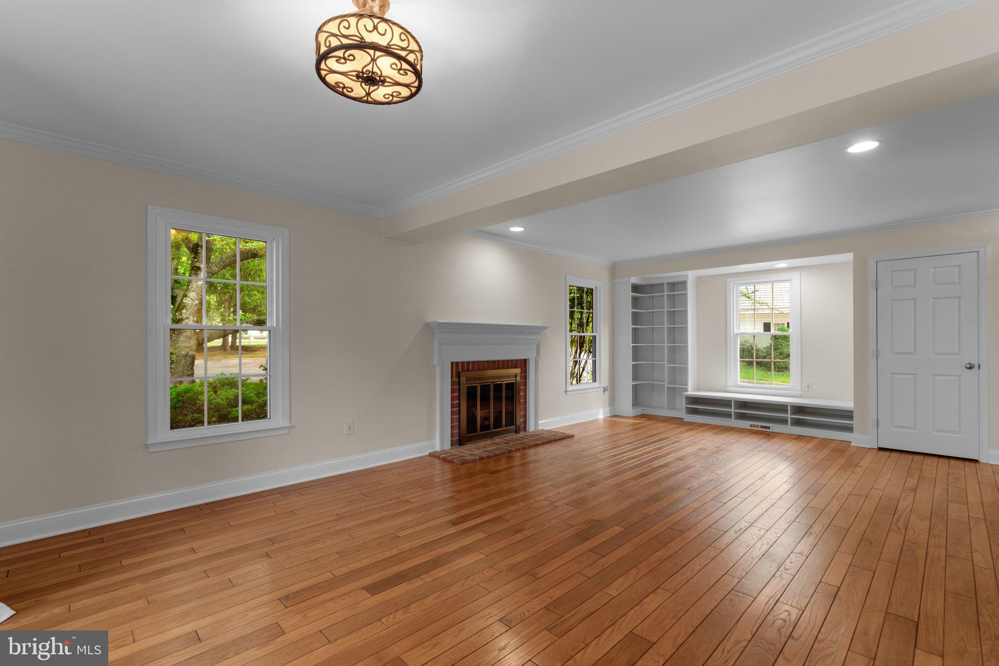 2 Oxley Square Road Gaithersburg, MD 20877 - Photo 9 of 49 an empty room with windows and fireplace