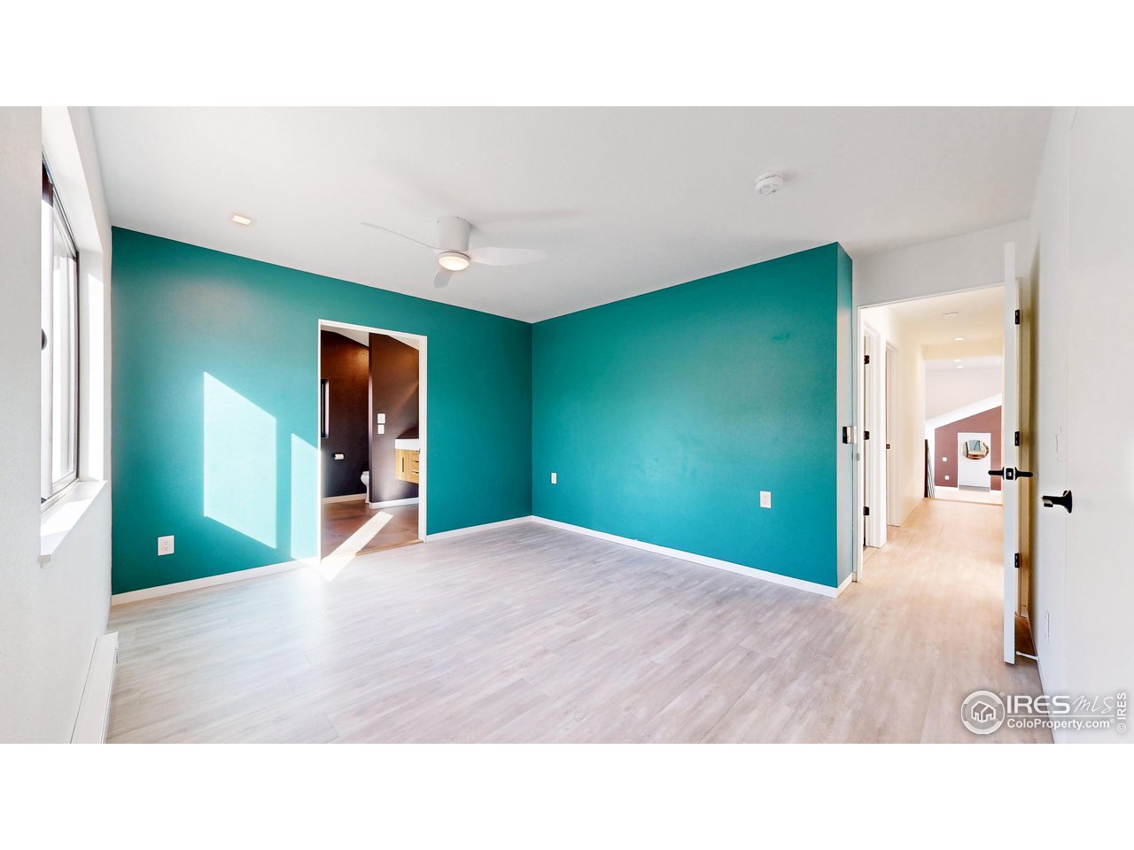 710 Tanager Road Estes Park, CO 80517 - Photo 12 of 43 Primary bedroom with ensuite bathroom.