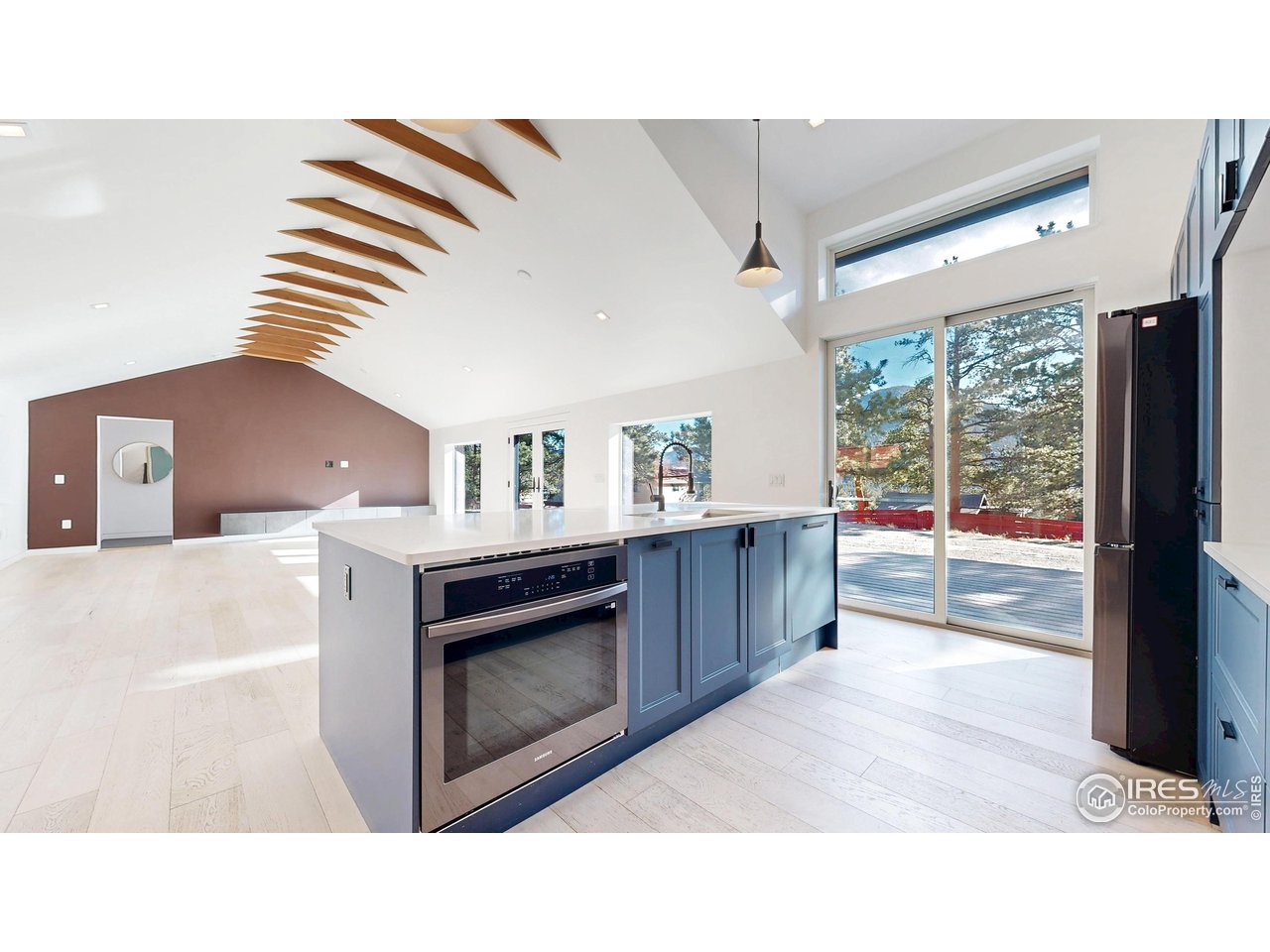 710 Tanager Road Estes Park, CO 80517 - Photo 10 of 43 Kitchen with sliding doors to the front deck.