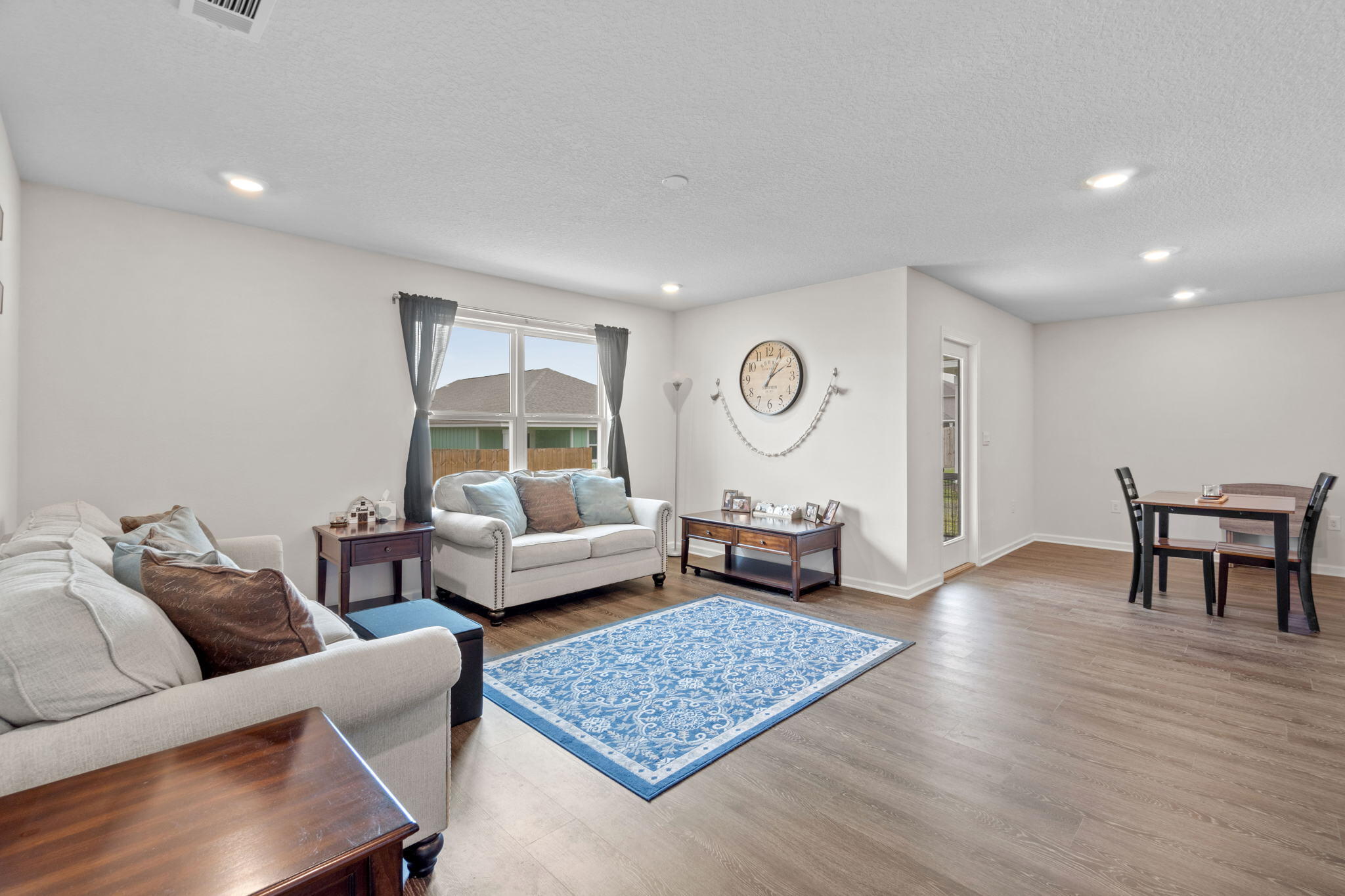 209 Laurel Hill Street Crestview, FL 32539 - Photo 19 of 43 a living room with furniture and a table