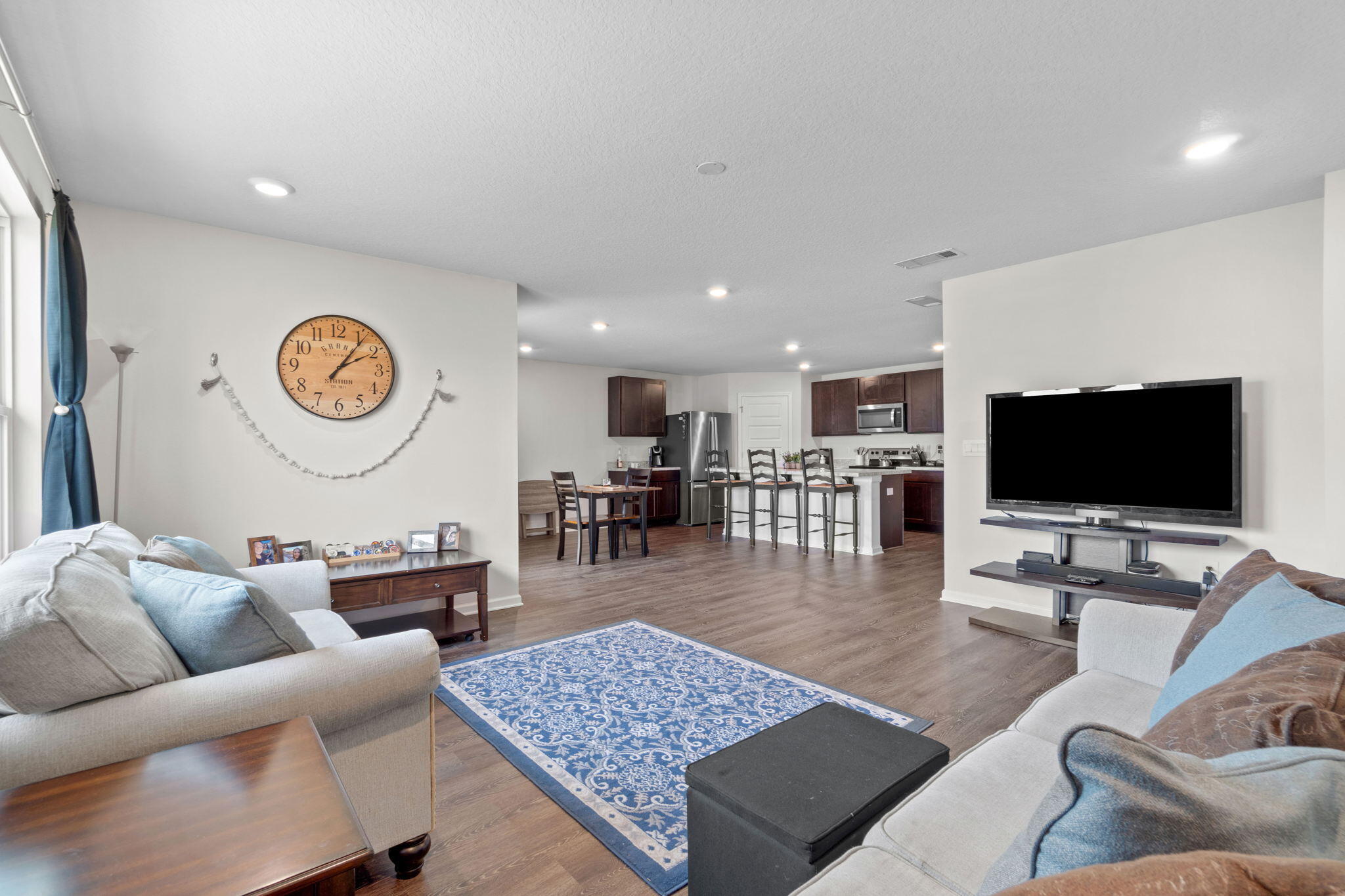 209 Laurel Hill Street Crestview, FL 32539 - Photo 20 of 43 a living room with furniture and a flat screen tv