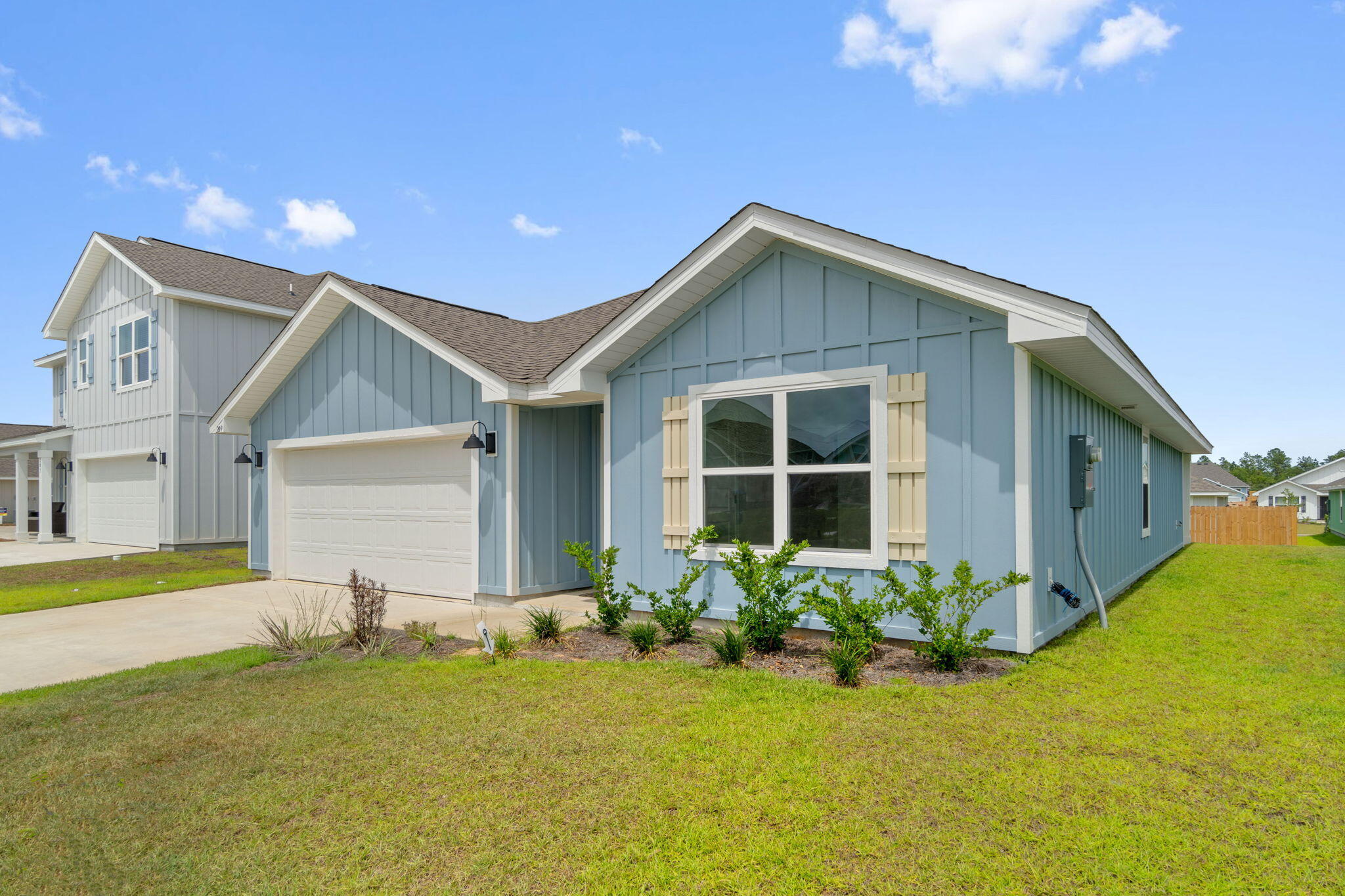 209 Laurel Hill Street Crestview, FL 32539 - Photo 2 of 43 a front view of house with yard and garage