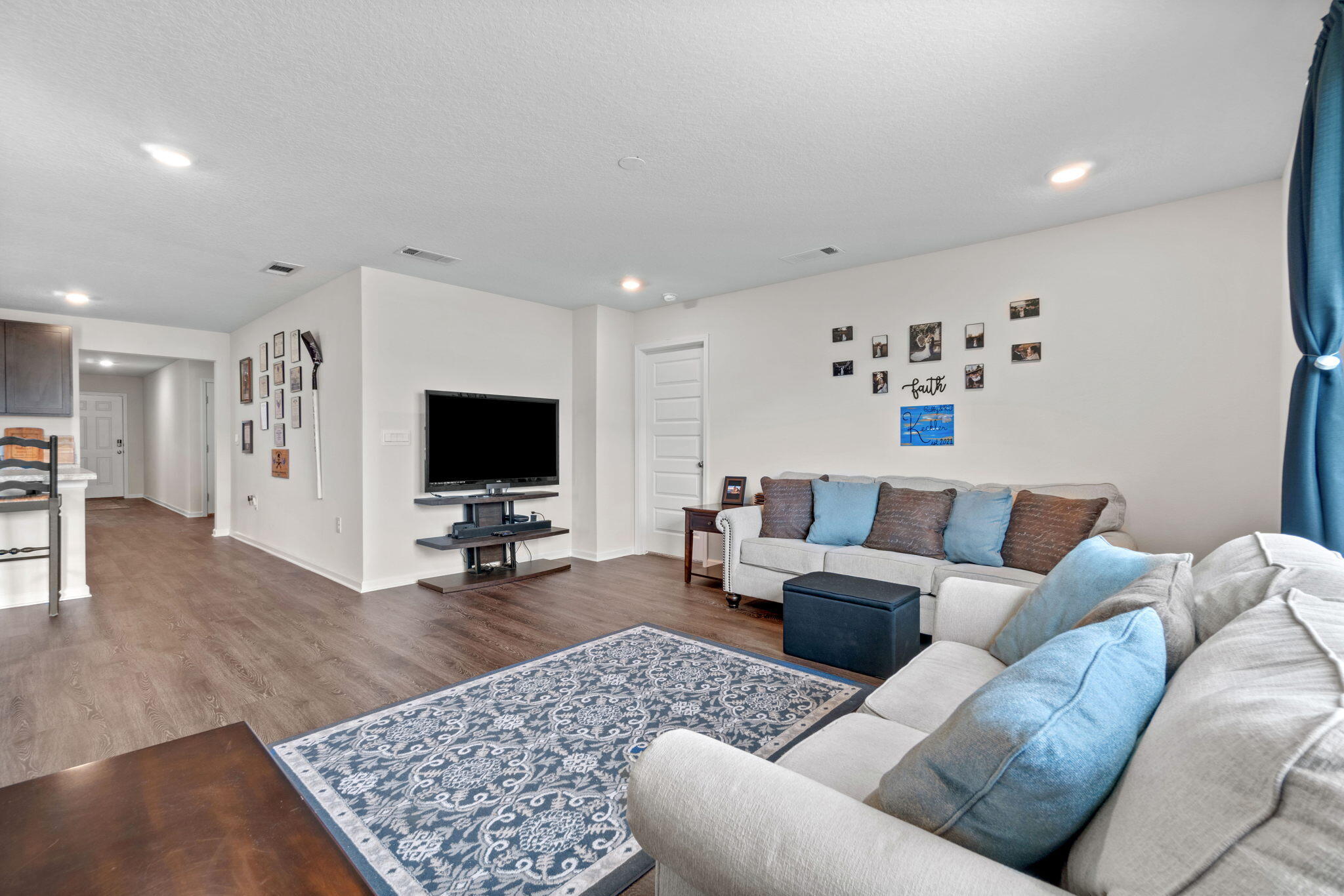 209 Laurel Hill Street Crestview, FL 32539 - Photo 21 of 43 a living room with furniture and a flat screen tv