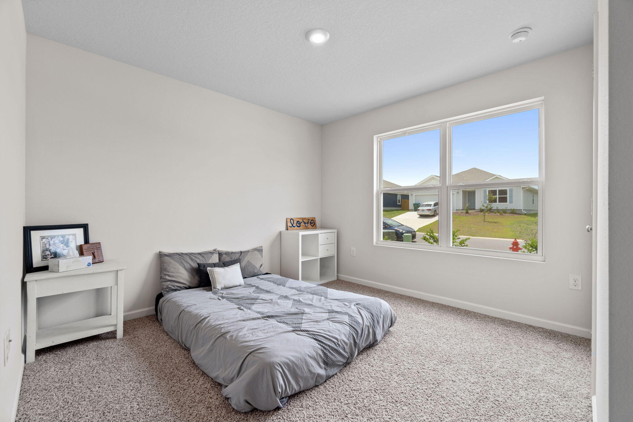 209 Laurel Hill Street Crestview, FL 32539 - Photo 22 of 43 a bedroom with a bed and a window