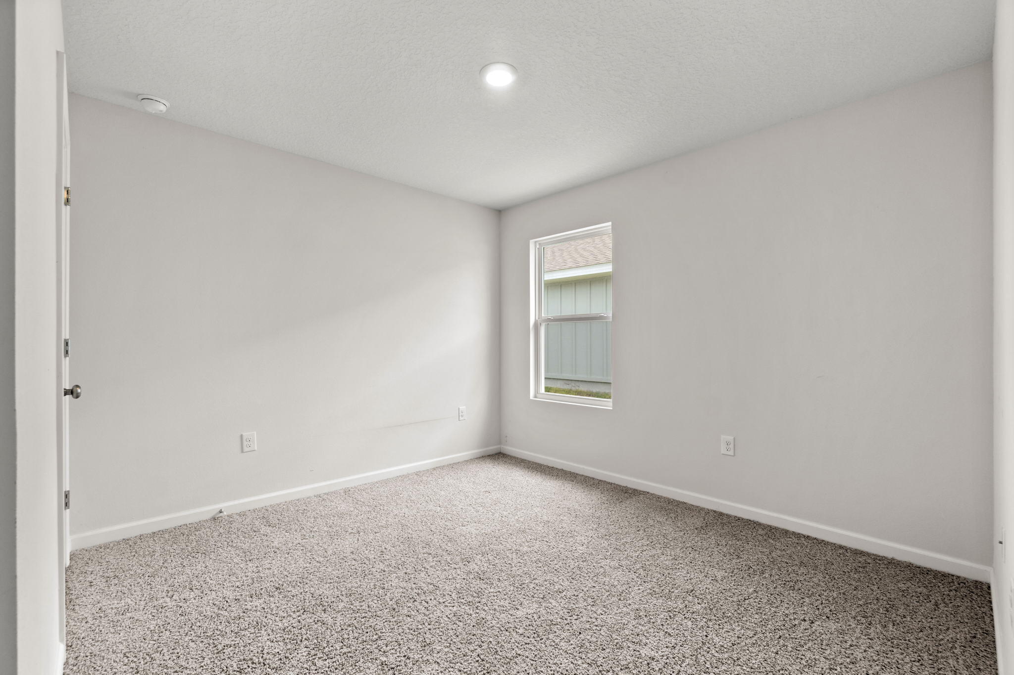 209 Laurel Hill Street Crestview, FL 32539 - Photo 25 of 43 a view of an empty room with a window