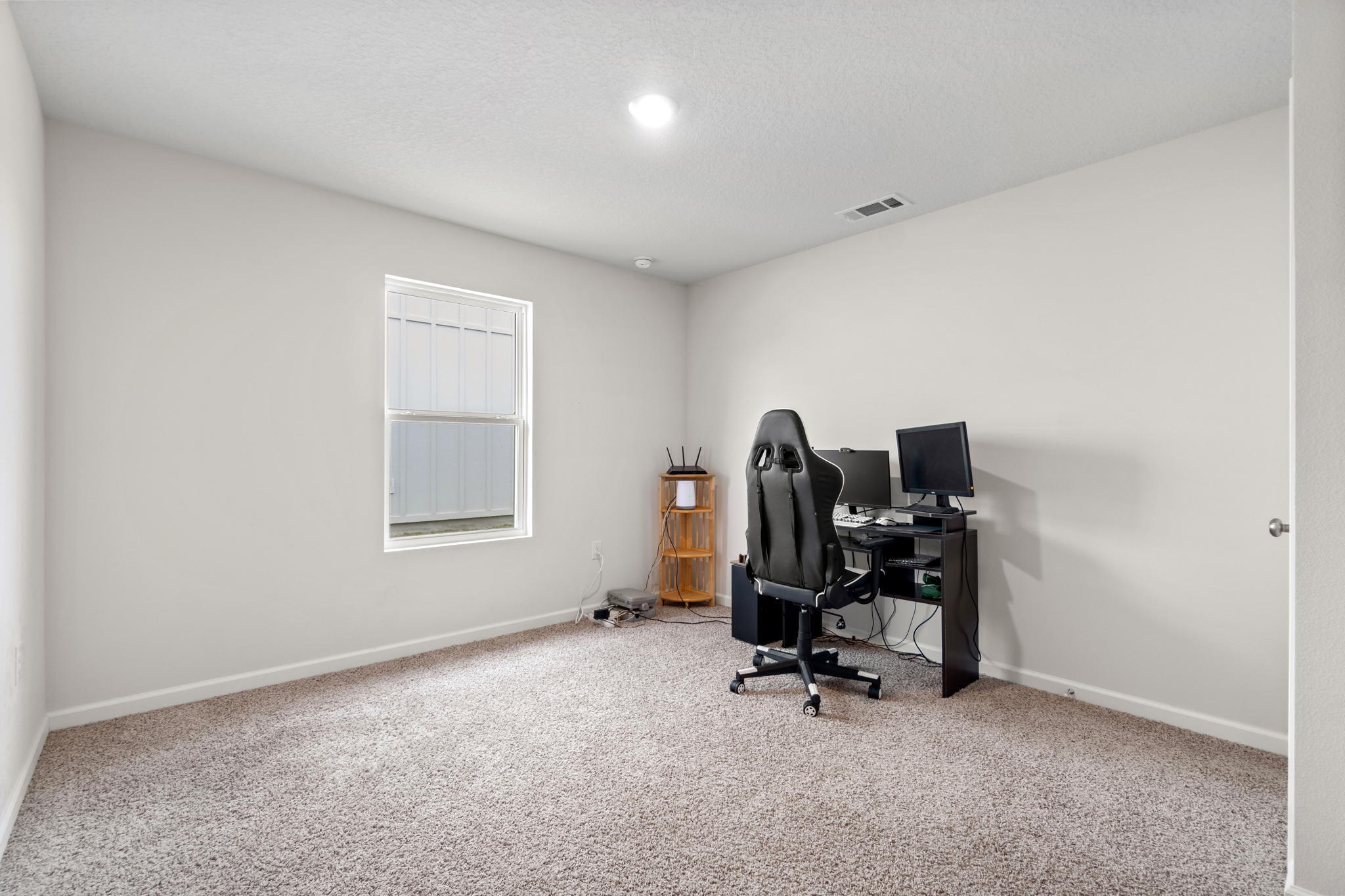 209 Laurel Hill Street Crestview, FL 32539 - Photo 27 of 43 a view of a workspace with furniture and a window