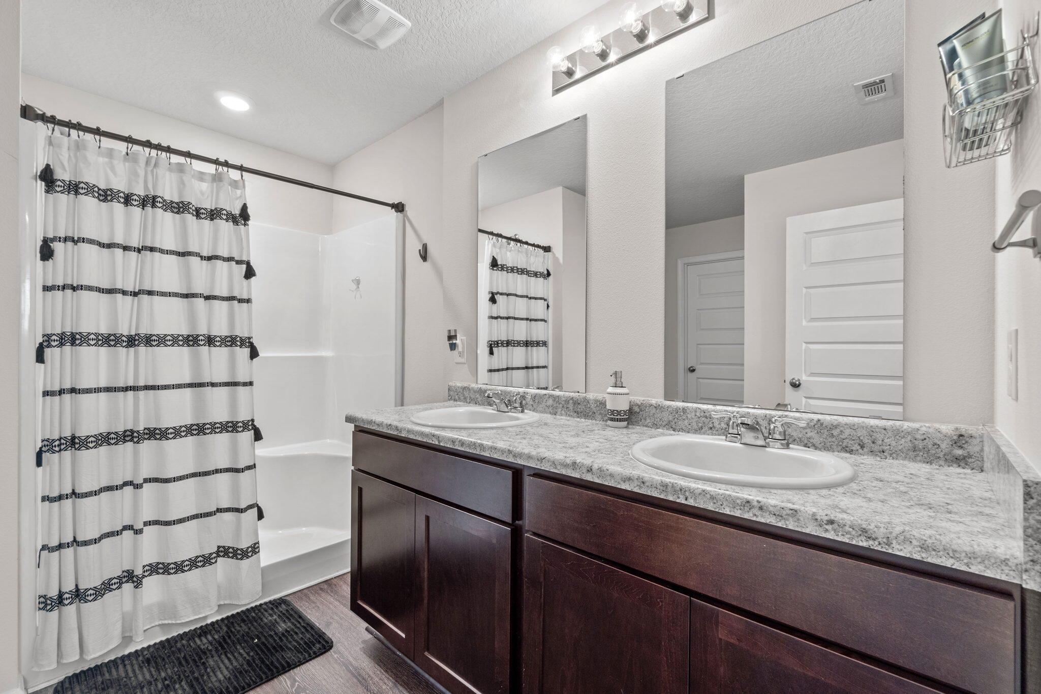 209 Laurel Hill Street Crestview, FL 32539 - Photo 33 of 43 a bathroom with a granite countertop sink and a mirror