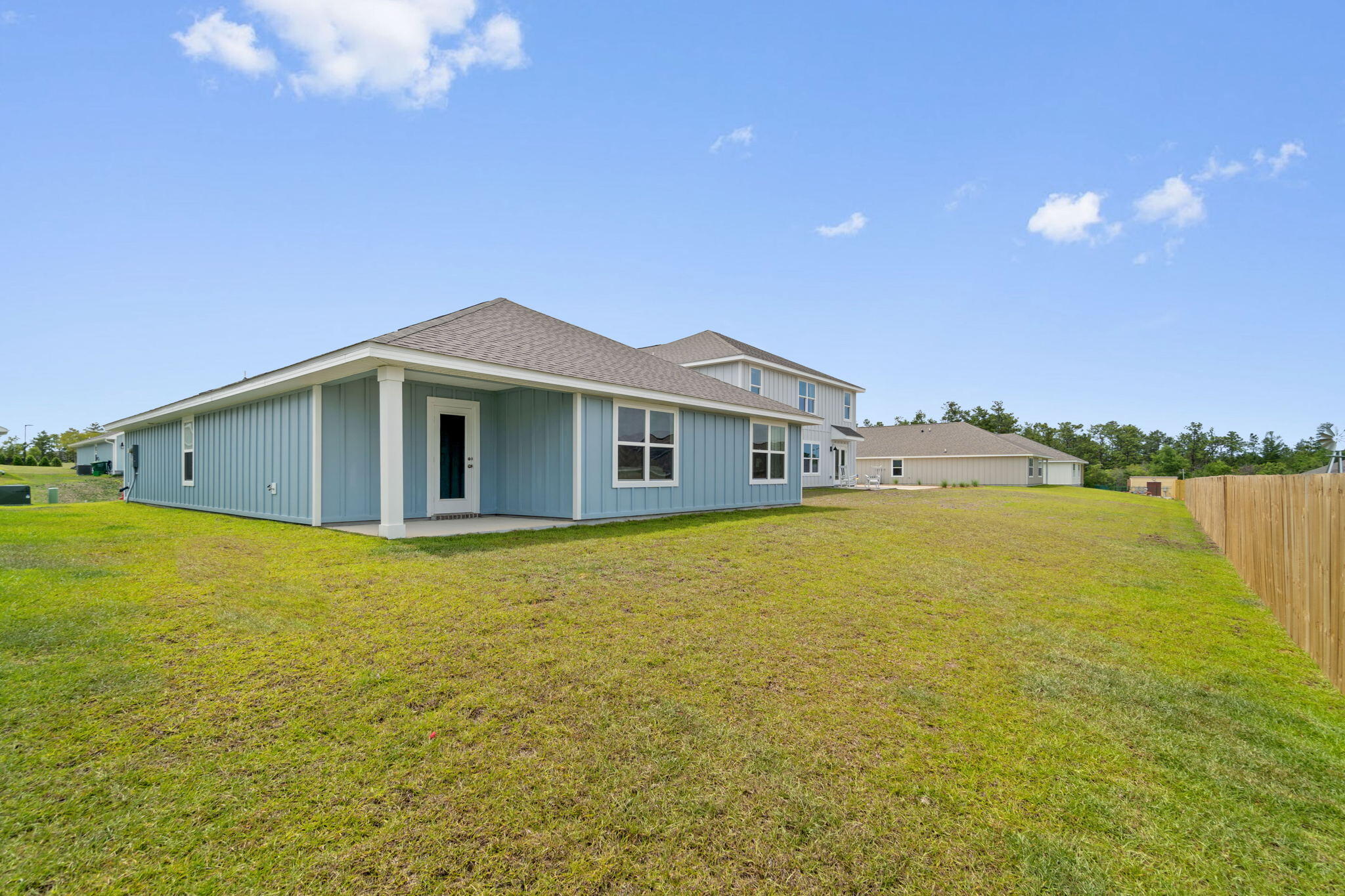 209 Laurel Hill Street Crestview, FL 32539 - Photo 40 of 43 a front view of a house with a lake view