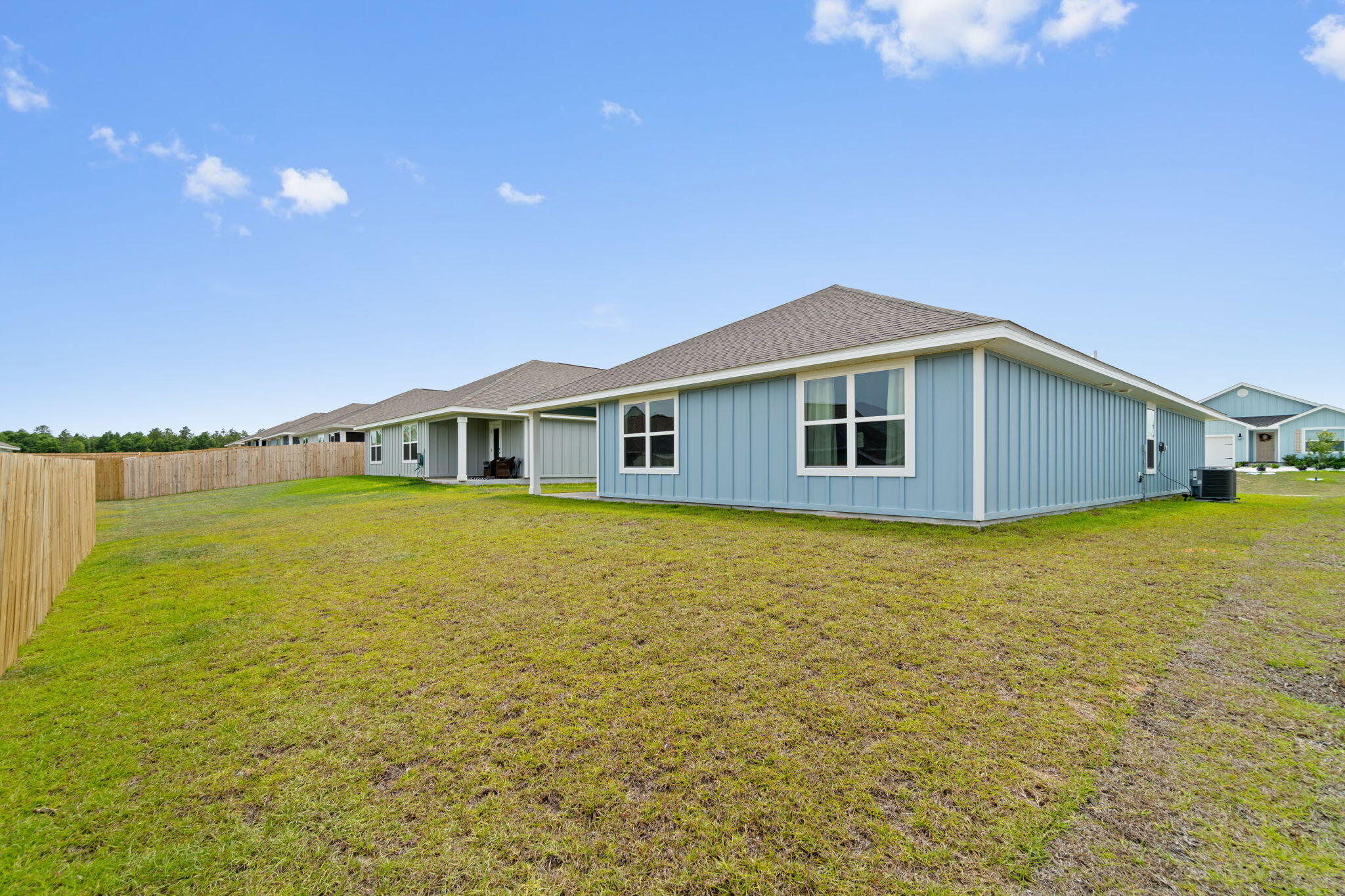 209 Laurel Hill Street Crestview, FL 32539 - Photo 41 of 43 a front view of a house with a yard