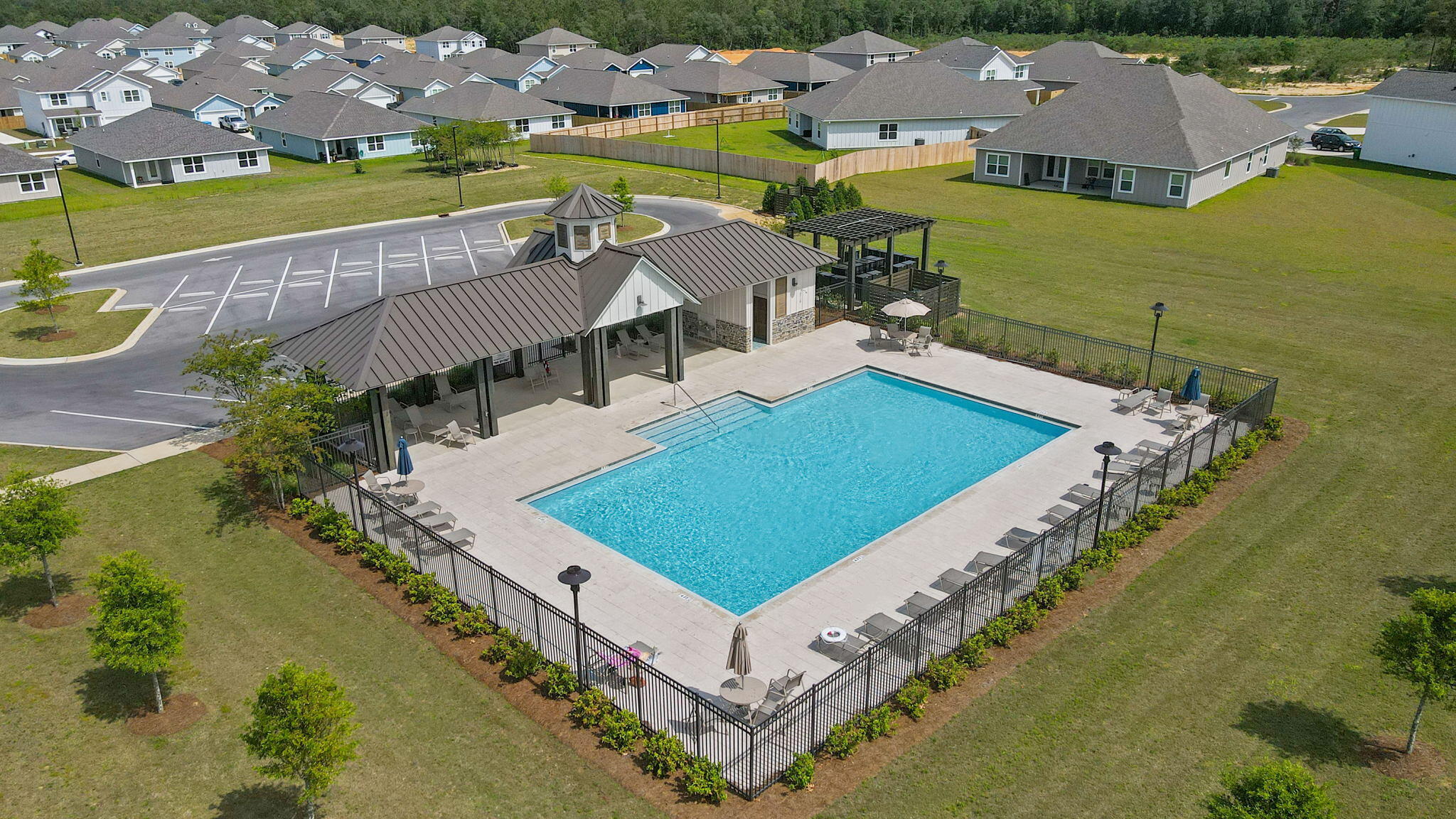 209 Laurel Hill Street Crestview, FL 32539 - Photo 43 of 43 an aerial view of a house with a garden and lake view