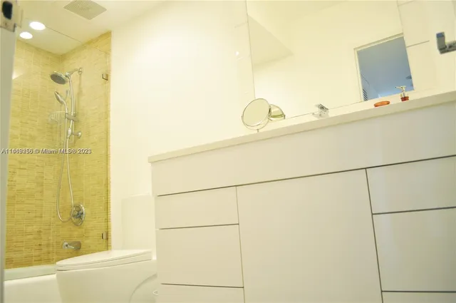 a bathroom with a tub and shower