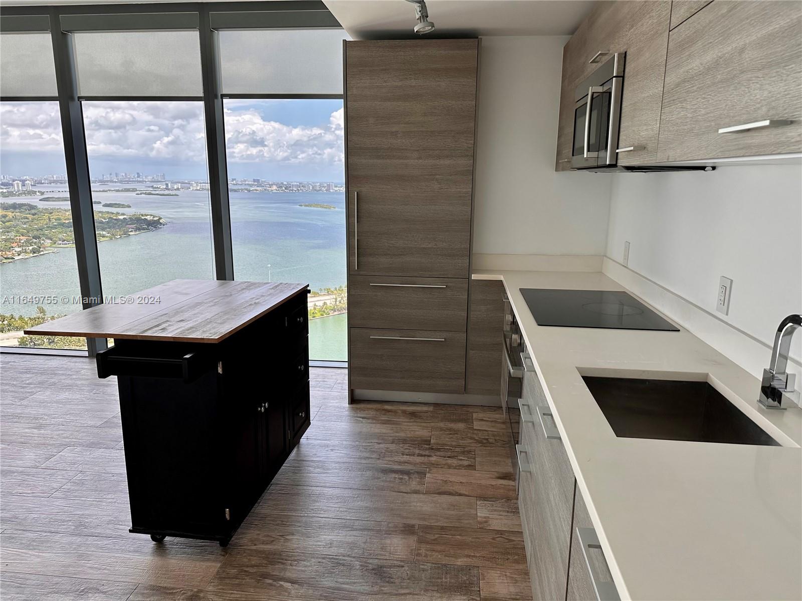 Edgewater Miami, FL 33137 - Photo 13 of 13 a kitchen with a sink and cabinets