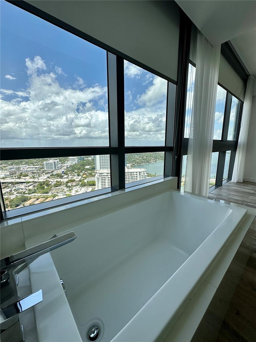 Edgewater Miami, FL 33137 - Photo 10 of 13 a view of a room with furniture and mountain view