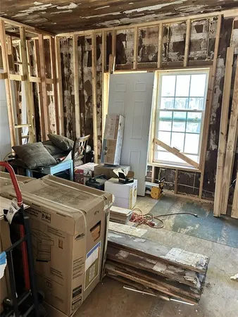 a view of a living room with furniture and a window
