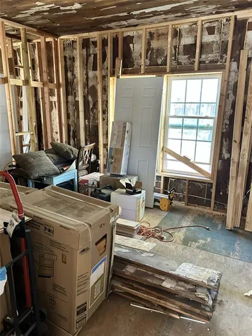 a view of a living room with furniture and a window