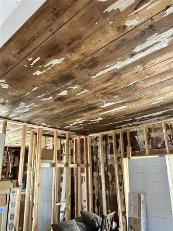 a bath tub sitting in a bathroom next to a window