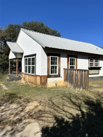 a house view with a garden space