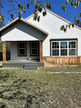 a house with yard in front of it