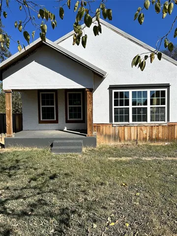 a house with yard in front of it