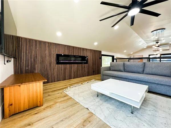 a lobby with furniture and a wooden floor