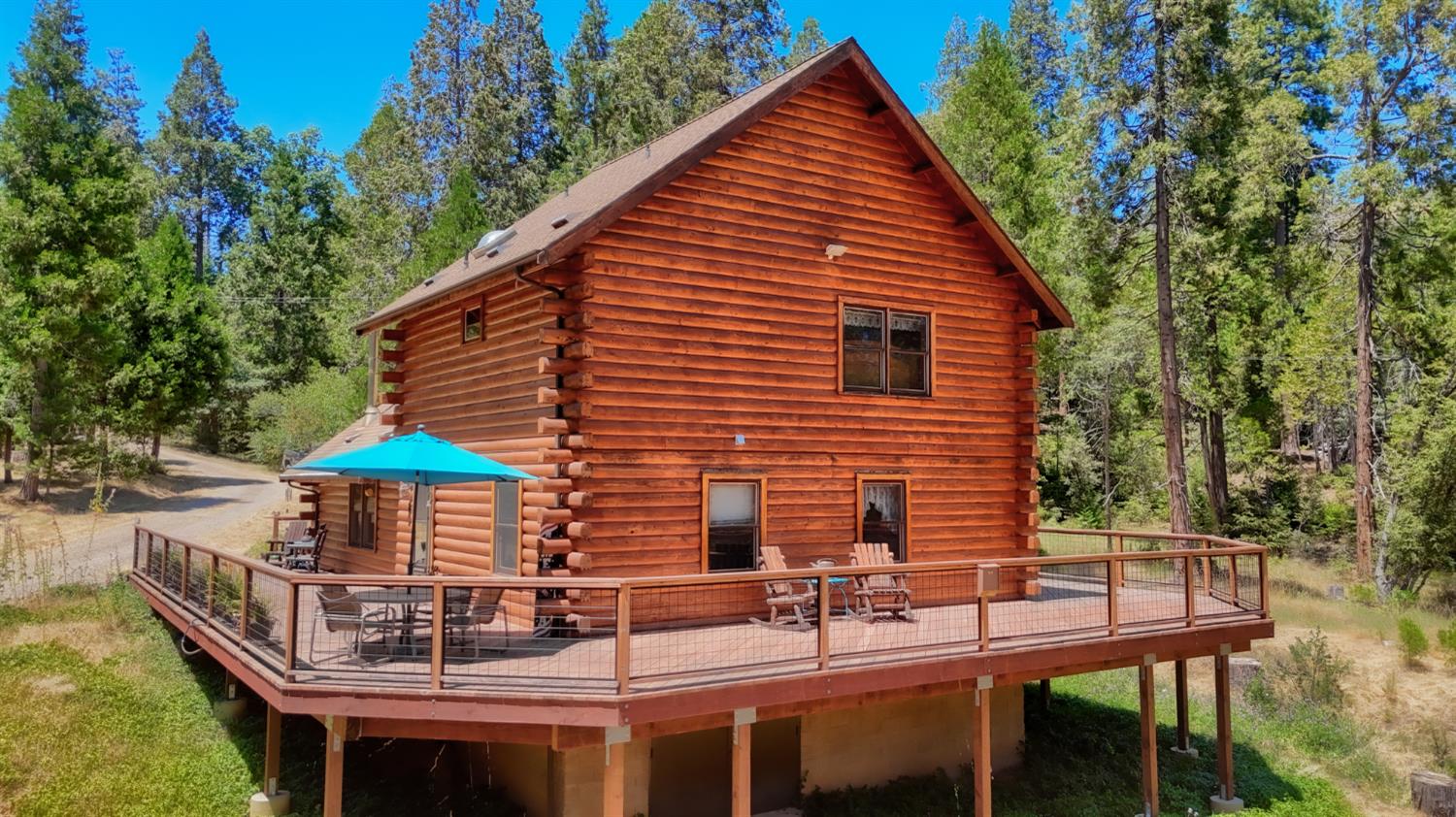 7190 Hites Cove Road Mariposa, CA 95338 - Photo 2 of 61 a backyard of a house with table and chairs