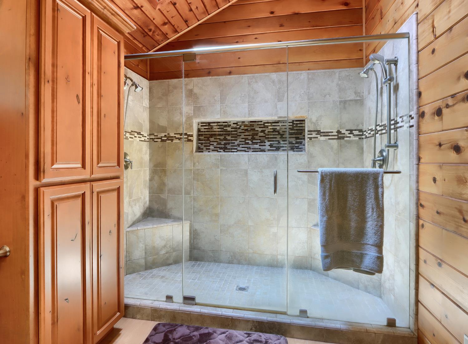 7190 Hites Cove Road Mariposa, CA 95338 - Photo 23 of 61 a bathroom with a glass shower door