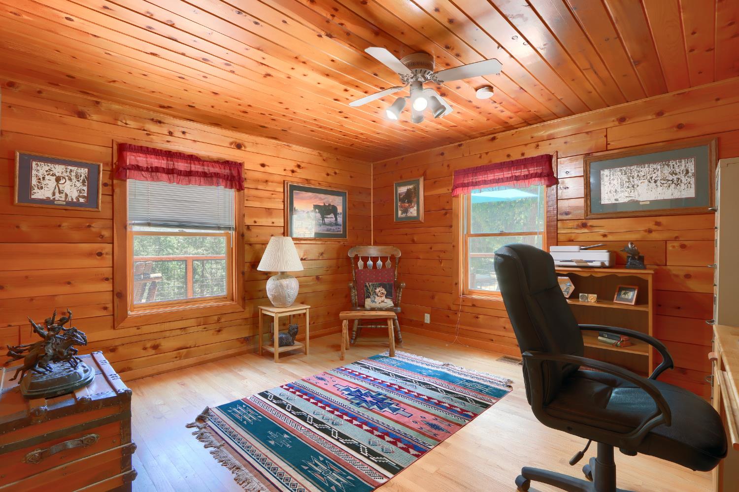 7190 Hites Cove Road Mariposa, CA 95338 - Photo 27 of 61 a living room with furniture a rug and wooden floor