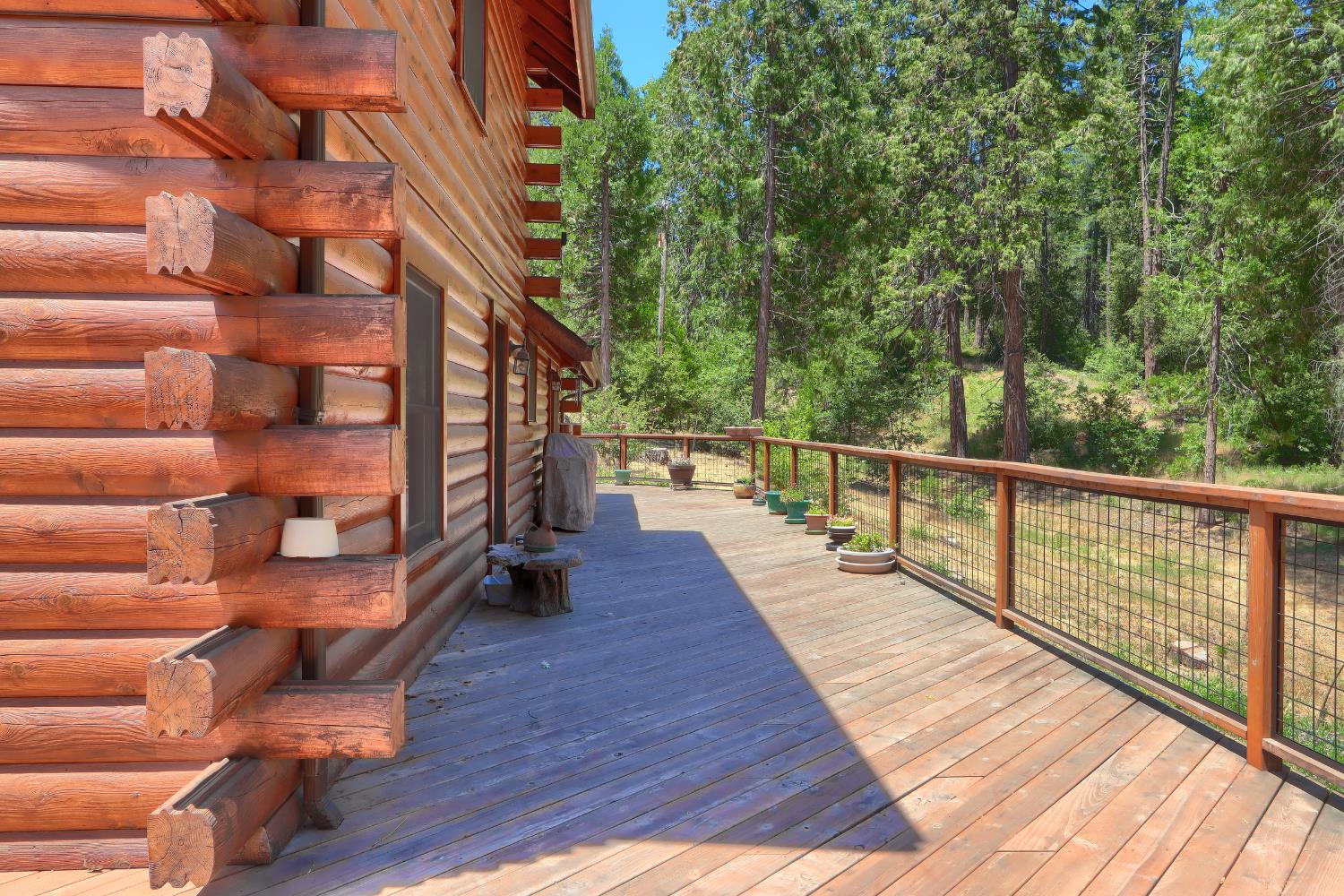 7190 Hites Cove Road Mariposa, CA 95338 - Photo 33 of 61 a view of balcony with wooden floor and fence